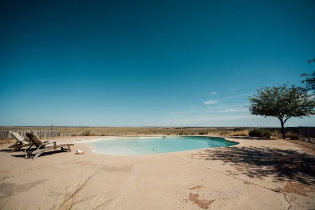 West Texas backyard pool under a wide open sky