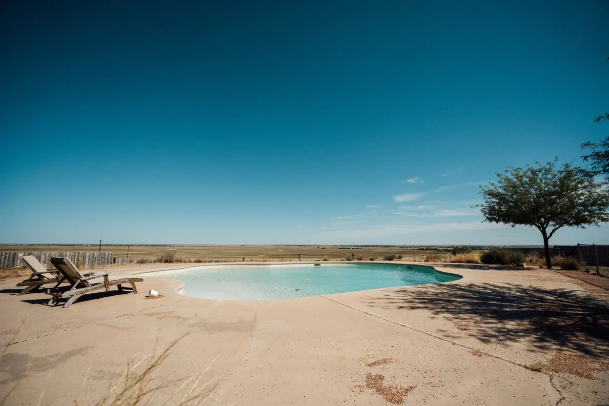 West Texas backyard pool under a wide open sky